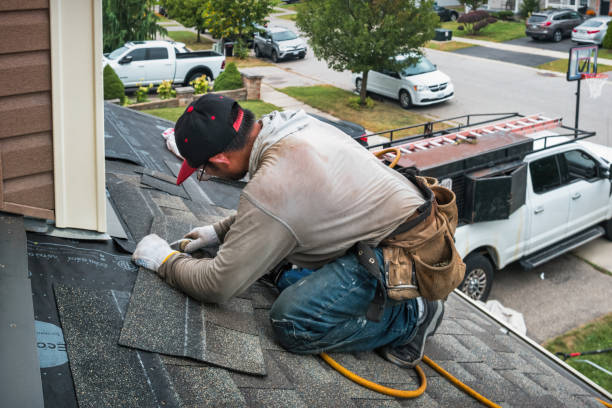 Professional Flat Roof Repair technician working in Conesville, IA